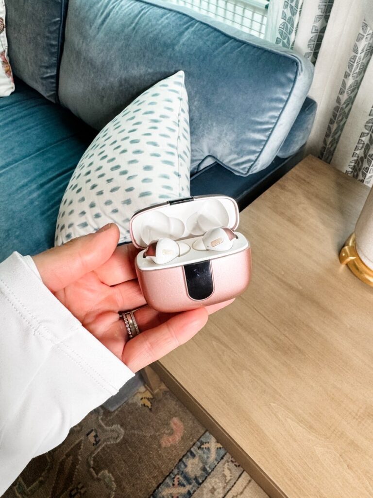 Photo of budget-friendly wireless headphones with a sleek design, displayed alongside their charging case. The case features a digital battery level indicator, making these headphones perfect for workouts, music, and podcasts on the go.