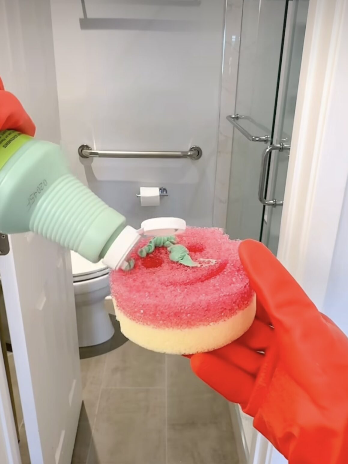How to Clean Glass Shower Doors - Put on your gloves and generously apply the cleaner to the glass. Let it sit for 5–10 minutes to break down the grime.